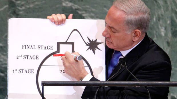 Israeli PM Binyamin Netanyahu draws a r
