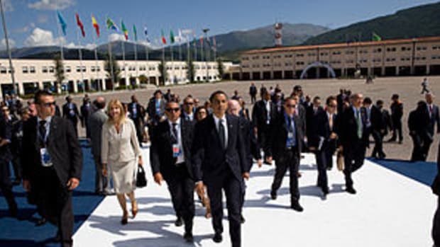 President Barack Obama walks through the G-8 s...