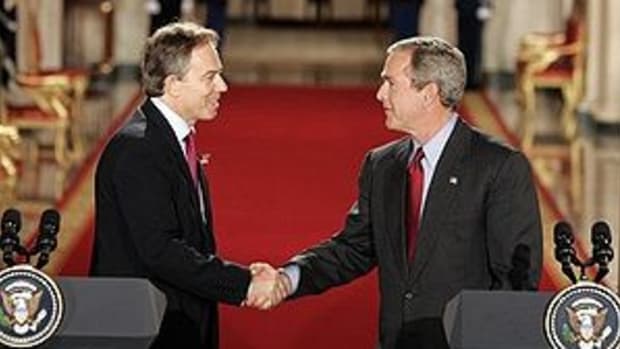 Tony Blair and George W. Bush shake hands afte...