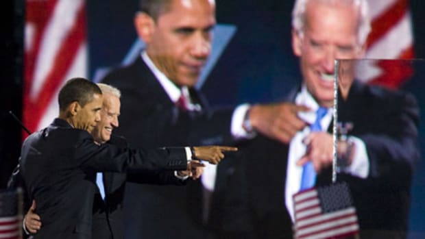 Barack Obama and Joe Biden celebreate their election victory in Chicago