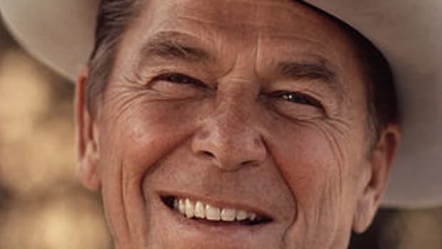 Ronald Reagan wearing cowboy hat at Rancho del...