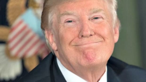 Trump-Fake-Smile-NICHOLAS-KAMMAFPGetty-Images-640x480
