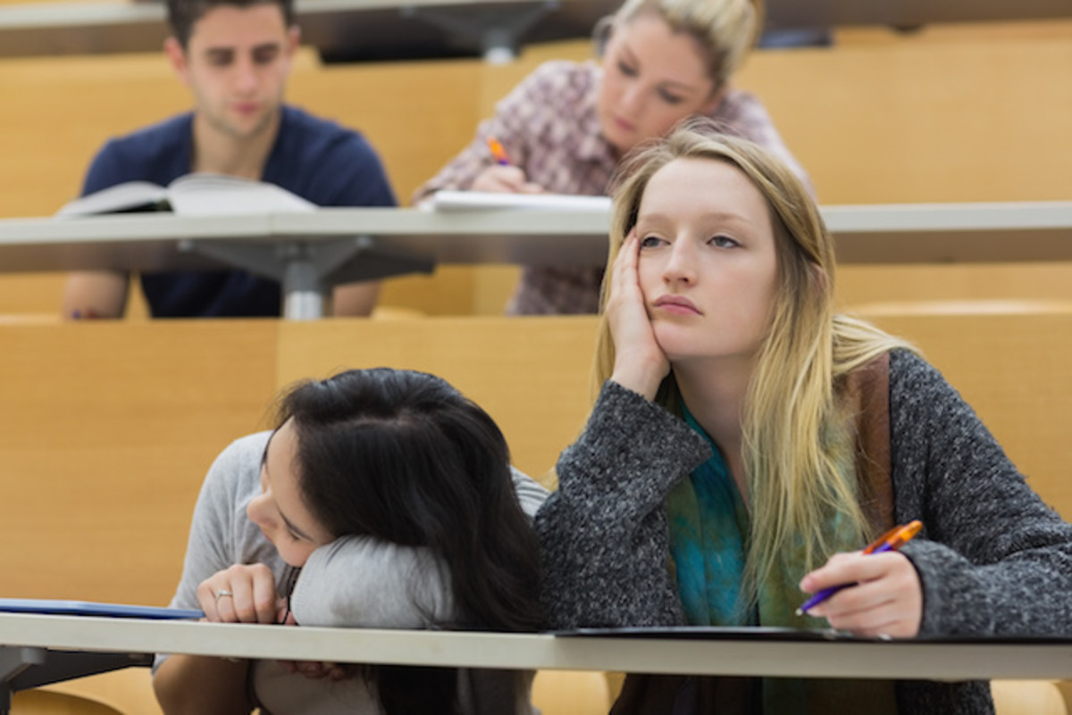 Demotivated students sitting in a lectu