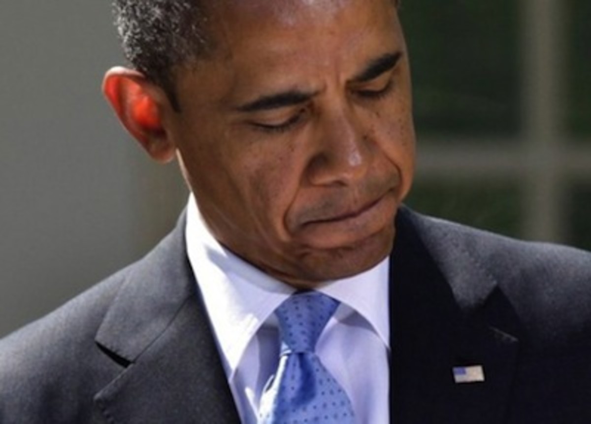 US President Barack Obama pauses during