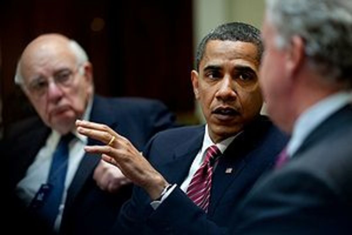 President Barack Obamaa, flanked by Paul Volck...