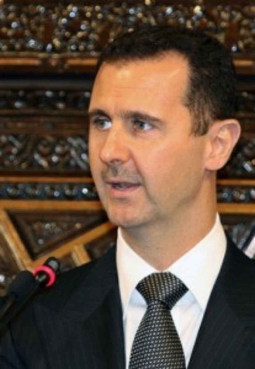 Syria's President Bashar al-Assad delivers a speech to Arab parliamentarians in Damascus