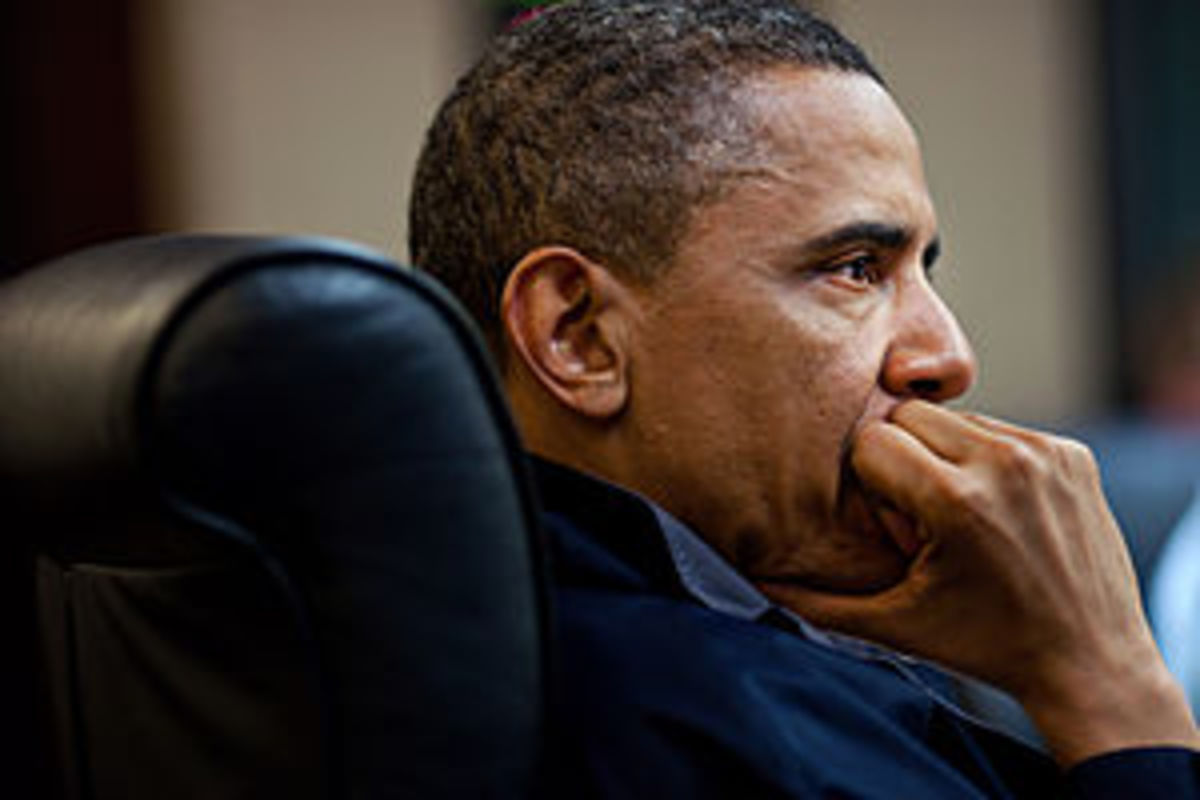 President Barack Obama listens during one in a...