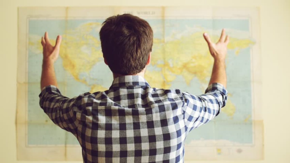 Man Looking At World Map